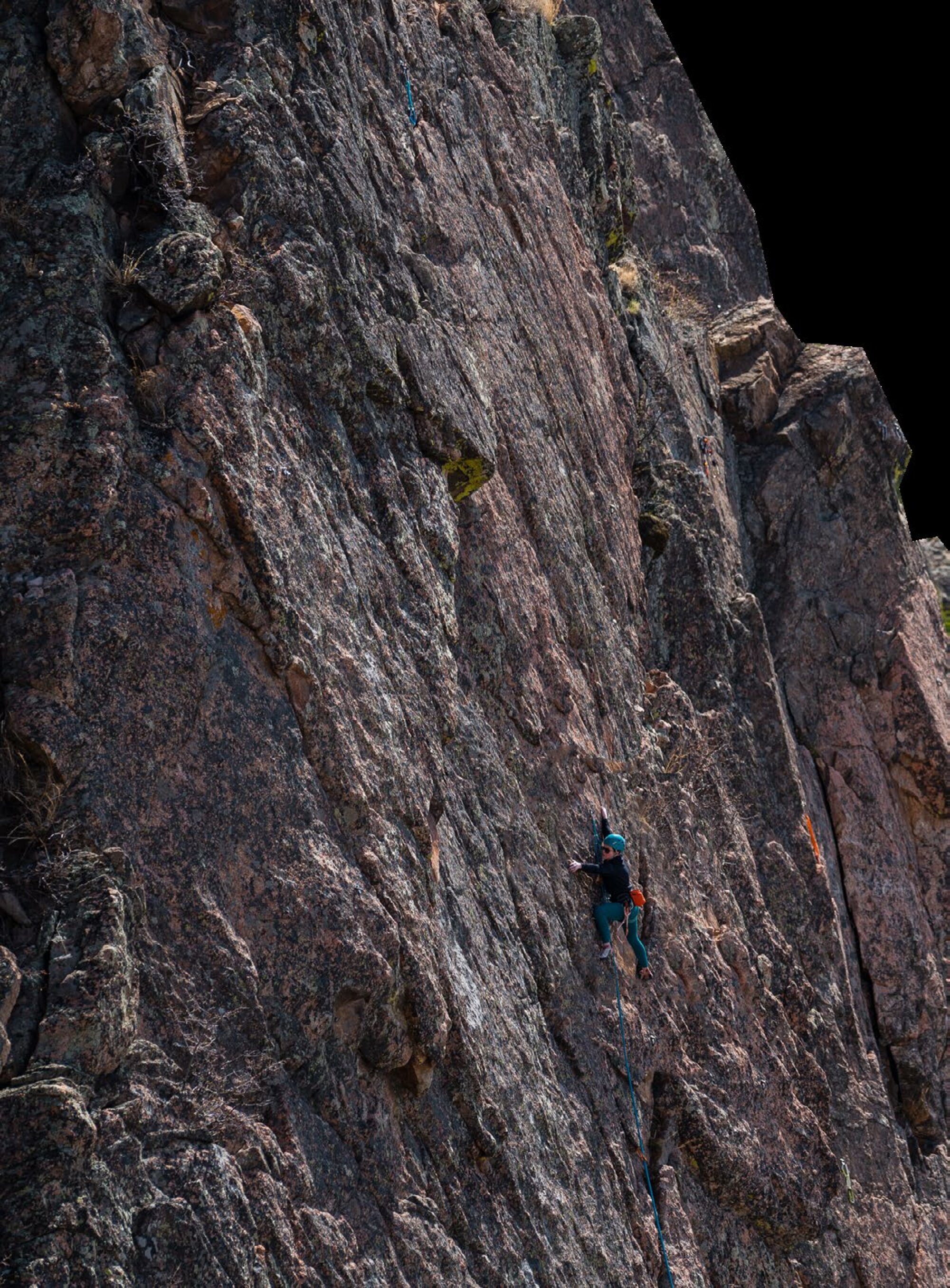 Climber ascending a granite rock face on an ARMBURY rope