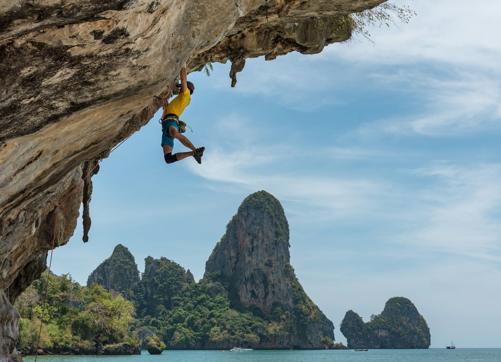 Climber ascending an overhanging limestone cliff on an ARMBURY sport climbing rope